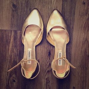 Gold pointed toe flats with ankle strap.